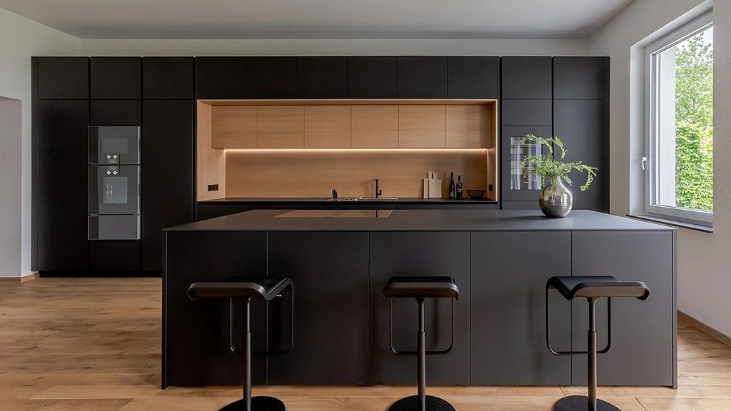 Black matte cabinets with wood accent niche